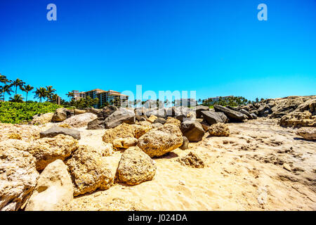 The rocky shoreline of the west coats of the island of Oahu at the resort area of Ko Olina in the island state of Hawaii in the Pacific Ocean Stock Photo