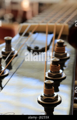 Six string guitar with shallow focus on tuning pegs Stock Photo