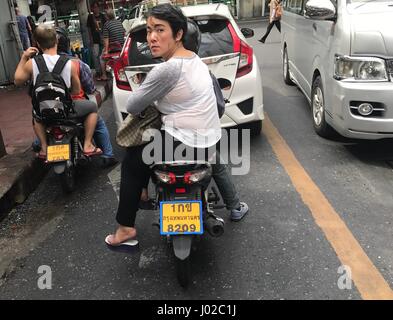 Bangkok, Thailand. 7th Apr, 2017. Motorcycles snake through heavy traffic in Bangkok, Thailand, 7 April 2017. Thailand's streets are amongst the most dangerous in the world. The kingdom has almost ten times as many road accident deaths as Germany - it is the number one cause of death amongst tourists. The risk is greatest every year during the Songkran festival. Photo: Christoph Sator/dpa/Alamy Live News Stock Photo