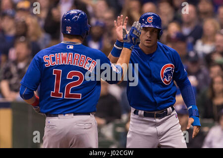 Milwaukee, WI, USA. 08th Apr, 2017. Chicago Cubs left fielder Kyle Schwarber #12 is congratulated by Chicago Cubs center fielder Albert Almora Jr. #5 after scoring on a Bryant double in the 3rd inning of the Major League Baseball game between the Milwaukee Brewers and the Chicago Cubs at Miller Park in Milwaukee, WI. Cubs defeated the Brewers 11-6. John Fisher/CSM/Alamy Live News Stock Photo