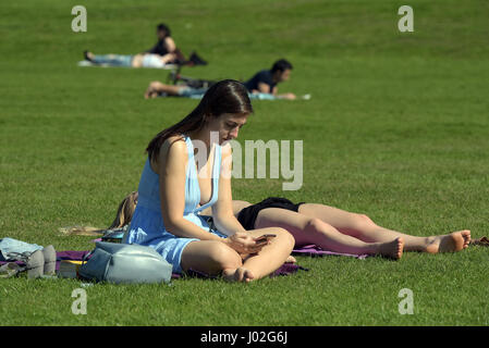 Greenwich Park, London, UK. 9th April, 2017. On what is predicted to be the warmest day of 2017 so far with the temperature reaching 24c, people enjoy the Spring sunshine in Greenwich Park London on 9th April 2017 Credit: MARTIN DALTON/Alamy Live News Stock Photo