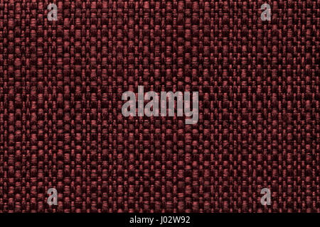 Dark red background with checkered pattern, closeup. Structure of the wine fabric macro. Stock Photo