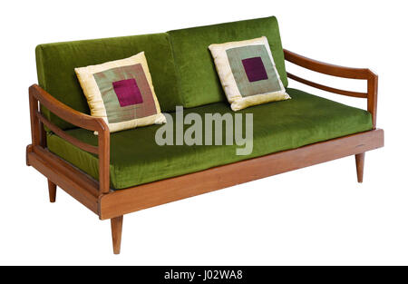 Green velvet sofa of fifties vintage design on short legs and wooden base isolated on white background Stock Photo