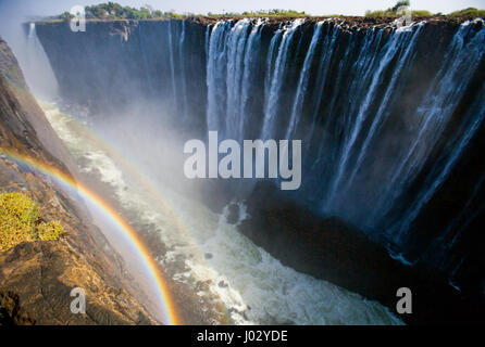 Victoria Falls. A general view with a rainbow. National park. Mosi-oa-Tunya National park. and World Heritage Site. Zambiya. Zimbabwe. Stock Photo