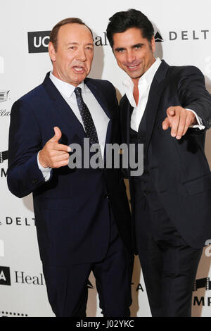 Honoree Kevin Spacey (L) and actor John Stamos attend the 4th Annual 'Reel Stories, Real Lives', benefiting the Motion Picture & Television Fund at Milk Studios on April 25, 2015 in Hollywood, California. Stock Photo