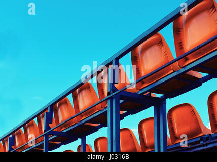 Back view of empty red seats in a stadium Stock Photo