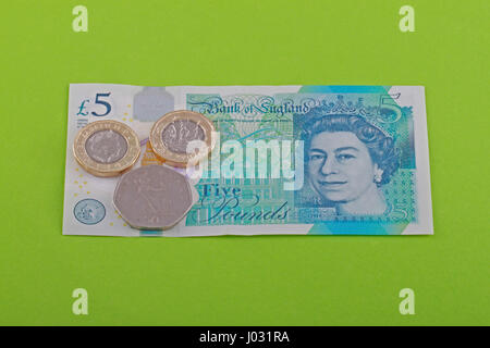 British, UK living wage of seven pounds and fifty pence came into force on the 1st April 2017. Photo taken against a green background. Stock Photo