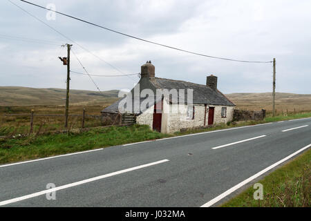 Turpeg Mynydd an abandoned turnpike cottage built in the 1820s beside the A543 road linking Denbigh to Pentrefoelas on the Denbigh Moors North Wales Stock Photo