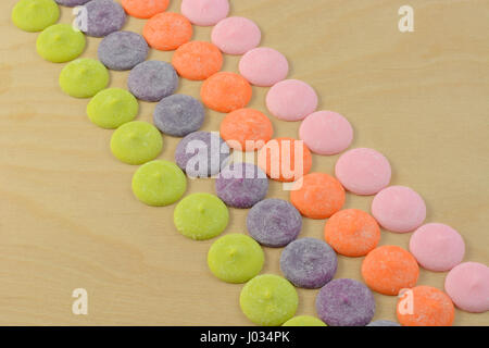 Multicolor white chocolate candy discs meltable for decorating food and craft projects Stock Photo