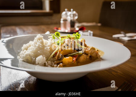 Thai chicken with vegetables and spice curry and rice Stock Photo