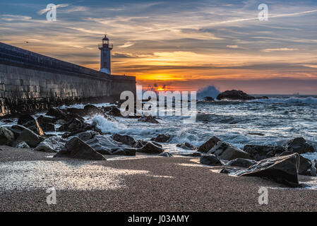 View from Carneiro beach on a Felgueiras Lighthouse during sunset over Atlantic Ocean in Foz do Douro district of Porto city, Portugal Stock Photo