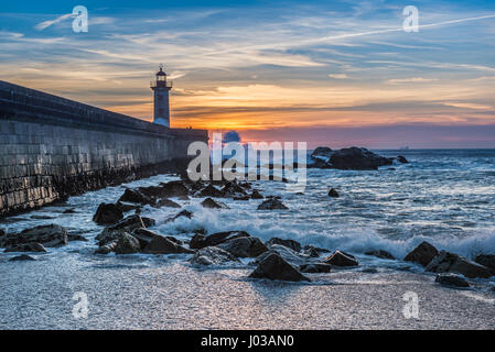 View from Carneiro beach on a Felgueiras Lighthouse during sunset over Atlantic Ocean in Foz do Douro district of Porto city, Portugal Stock Photo