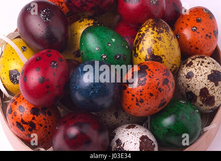 Hand-painted pastel colored Easter quail eggs background Stock Photo