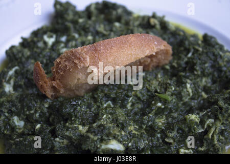 White dish with stew prepared for eating Stock Photo