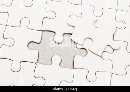 Plain white jigsaw puzzle. Stock Photo