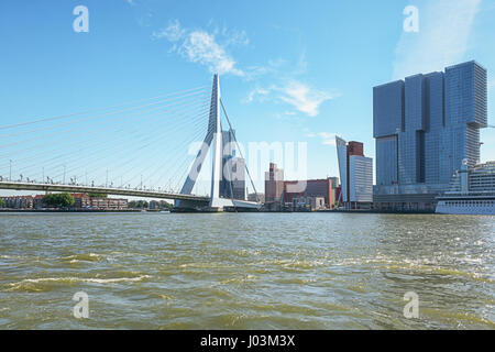 Rotterdam, Netherlands – August 18, 2016: Picture of the Erasmus bridge and for the building the Rotterdam along the Wilhelminakade has the AIDA cruis Stock Photo