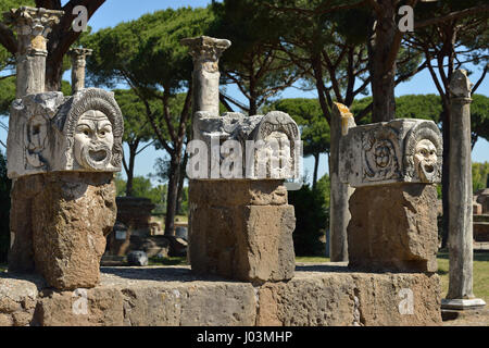 Rome. Italy. Ostia Antica. Marble theatrical masks at the rear of the theatre. Stock Photo