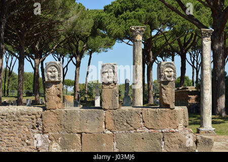 Rome. Italy. Ostia Antica. Marble theatrical masks at the rear of the theatre. Stock Photo
