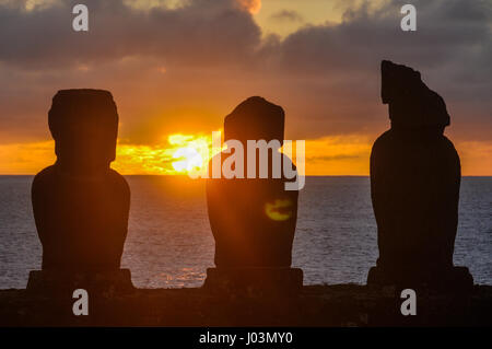 Moai statues at sunset Ahu Tahai site, on the coast of Easter Island, Chile Stock Photo
