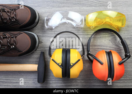 Protection accessories for construction from above. Work and protective clothes close-up. Work protection background.  Good construction background. Stock Photo