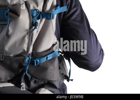 Close-up of backpack on man back isolated on white background. Traveler with blue backpack closeup. Stock Photo