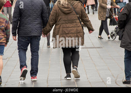 couple walking along holding hands on spring day in city centre Liverpool UK Stock Photo