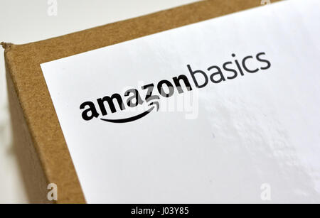 MONTREAL, CANADA - MARCH 28, 2017: Amazon Basics shipping box with branded label on it. Amazon is an American electronic commerce and cloud computing  Stock Photo