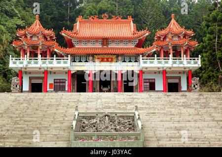 KAOHSIUNG, TAIWAN -- JANUARY 30, 2015:  The traditional Gong De Temple in the foothills of Liu-Yi Mountain is surrounded by dense forests. Stock Photo