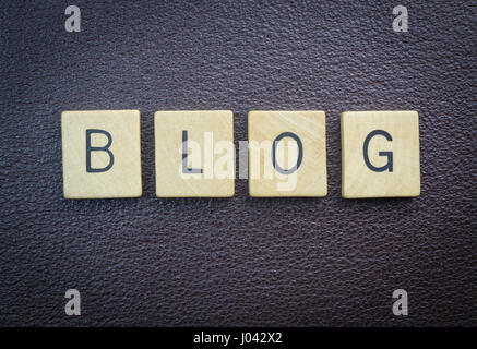 Blog word concept wood pieces on brown leather Stock Photo