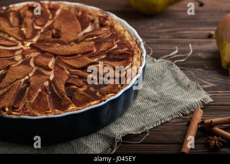 Fresh pear pie with spieces on a wooden background Stock Photo
