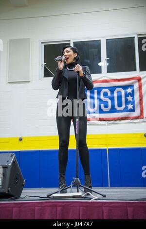 Singer Bridget Kelly performs for U.S. soldiers during the annual USO Holiday Tour at the Naval Support Activity Souda Bay December 8, 2013 in Souda Bay, Greece.      (photo by MCS2 Amanda R. Gray /US Navy  via Planetpix) Stock Photo