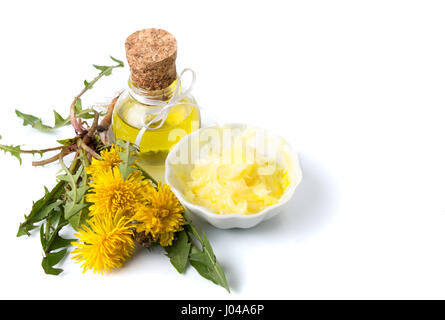 Dandelion flowers with tincture and salve isolated on white Stock Photo