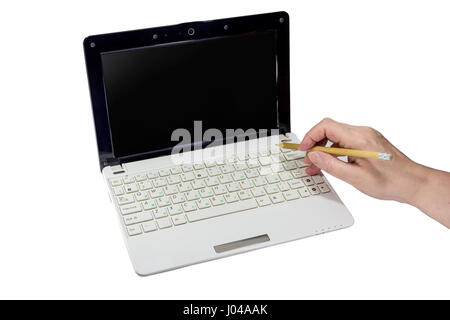 pushing Enter button on computer by the palm with pencil on white background Stock Photo