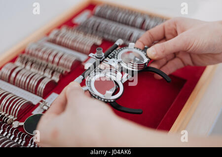 Eye examination glasses being taken out of the box Stock Photo