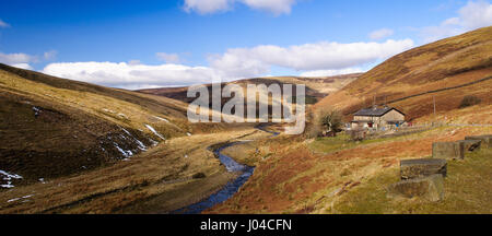 A river cuts the deep Trough of Bowland valley through the high moorland and hills of the Forest of Bowland in Lancashire. Stock Photo