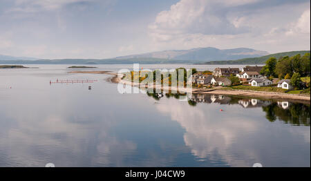 Houses are clustered on a sheltered peninsula in the village of Connel Ferry, beside Loch Etive and the north Atlantic coast of the West Highlands of  Stock Photo