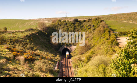 Weymouth, England - May 18, 2013: A South West Trains class 444 passenger train exits a tunnel on the South West Main Line under the South Dorset Ridg Stock Photo