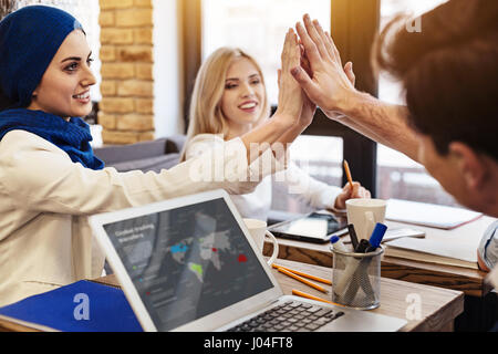 Cheerful businesscolleagues celebrating success Stock Photo