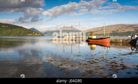 The Vital Spark, a famous 'Clyde Puffer' boat, is moored at Inveraray Pier in Loch Fyne in the West Highlands of Scotland. Stock Photo