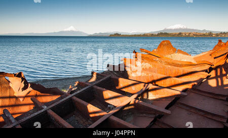 Lago Llanquihue lake at Puerto Varas in Chilean Patagonia, with the volcanic mountains of Osorno and Calbuco beyond. Stock Photo