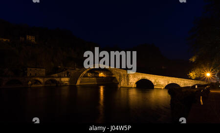 Ponte della Maddalena (Italian: 'Bridge of Mary Magdalene') is a bridge crossing the Serchio river near the town of Borgo a Mozzano in the Italian pro Stock Photo