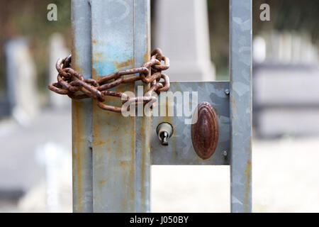 And old rusty iron handle, lock and chain Stock Photo