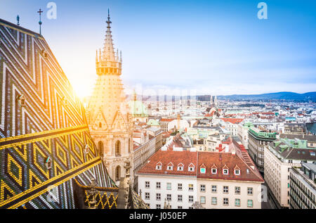 Aerial view over the rooftops of Vienna from the north tower of St. Stephen's Cathedral including the cathedral's famous ornately patterned, richly co Stock Photo