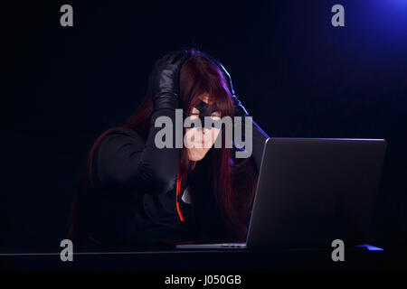 Photo of hacker in mask Stock Photo