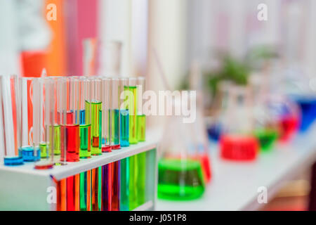 Laboratory expreriment with test-tubes with colored chemical reagents, retorts and flasks Stock Photo