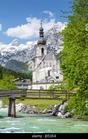 Scenic mountain landscape in the Bavarian Alps with famous Parish Church of St. Sebastian in the village of Ramsau in springtime, Bavaria, Germany Stock Photo