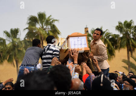 Borg El-Arab, Alexandria, Egypt. 10th Apr, 2017. Mourners carry the coffin of one of the victims of the blast at the Coptic Christian Saint Mark's church in Alexandria the previous day during a funeral procession at the Monastery of Marmina in the city of Borg El-Arab, east of Alexandria on April 10, 2017. Egypt prepared to impose a state of emergency after jihadist bombings killed dozens at two churches in the deadliest attacks in recent memory on the country's Coptic Christian minority Credit: Amr Sayed/APA Images/ZUMA Wire/Alamy Live News Stock Photo
