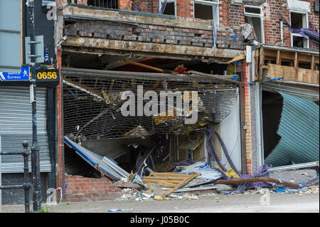 New Ferry, Wirral, UK. 10th April, 2017. The scene of the recent massive gas explosion has now been handed over from Merseyside Police to WIrral Borough Council.  The cleanup operation commences and, for the first time, residents and business owners are being allowed into the area to retrieve belongings, of which a great many clothes and personal effects are strewn across the scene.  The damage is so great, that a lot of the buildings will need to be demolished and rebuilt. © Paul Warburton Stock Photo