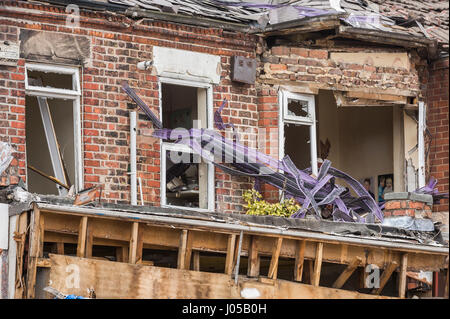 New Ferry, Wirral, UK. 10th April, 2017. The scene of the recent massive gas explosion has now been handed over from Merseyside Police to WIrral Borough Council.  The cleanup operation commences and, for the first time, residents and business owners are being allowed into the area to retrieve belongings, of which a great many clothes and personal effects are strewn across the scene.  The damage is so great, that a lot of the buildings will need to be demolished and rebuilt. © Paul Warburton Stock Photo