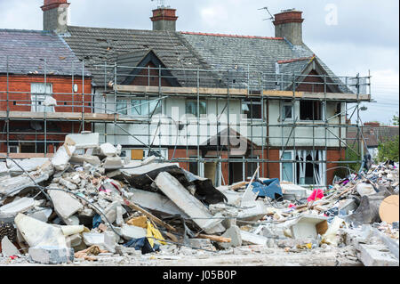 New Ferry, Wirral, UK. 10th April, 2017. The scene of the recent massive gas explosion has now been handed over from Merseyside Police to WIrral Borough Council.  The cleanup operation commences and, for the first time, residents and business owners are being allowed into the area to retrieve belongings, of which a great many clothes and personal effects are strewn across the scene.  The damage is so great, that a lot of the buildings will need to be demolished and rebuilt. © Paul Warburton Stock Photo